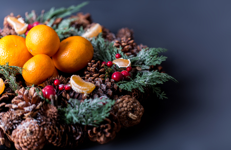 Tangerines with christmas decoration on rustic wooden background. Tangerines with spruce. Christmas decoration. Copy spaceの写真素材