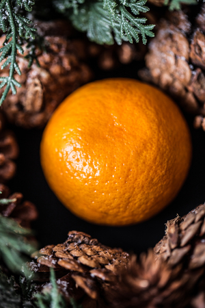 Tangerines with christmas decoration on rustic wooden background. Tangerines with spruce. Christmas decoration. Copy spaceの写真素材