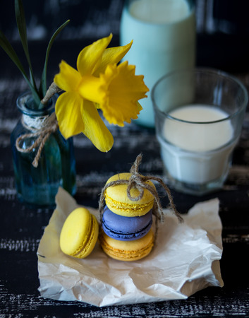 Colorful macaroons on a dark wooden background. Sweet macarons.の写真素材
