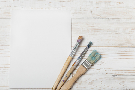 Art and craft tools.Artist's brush, canvas. Wooden art palette with tubes of acrylic paints.Artist's workshop.Art picture with copy space and for add text.Artist workplace background.Paints brushesの写真素材