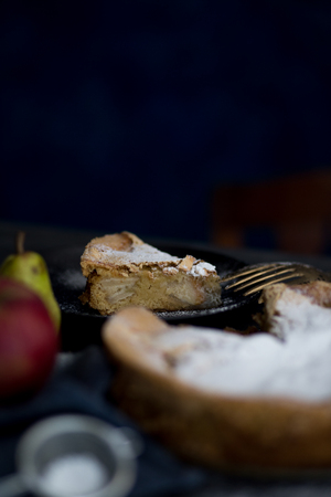 Homemade apple pie. Apple pie tart, ingredients - apples and cinnamon on rustic wooden backgroundの写真素材