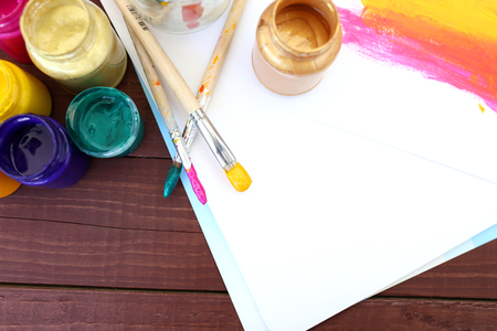 Multicolored plastic cans with paints. Artist workplace background. Art tools. Paints background. Colorful artist palette. Soft toned. Creativity, visual art concept. Art and craft. Closeupの写真素材