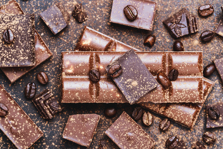 Chocolate bar pieces. Background with chocolate. Sweet food photo concept. The chunks of the broken chocolateの写真素材
