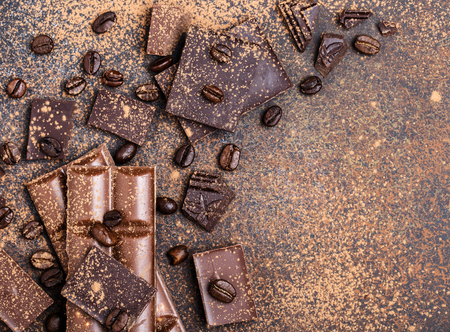 Chocolate bar pieces. Background with chocolate. Sweet food photo concept. The chunks of the broken chocolateの写真素材