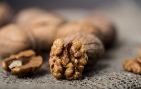 Walnuts. Walnut kernels and whole walnuts on rustic table.の写真素材