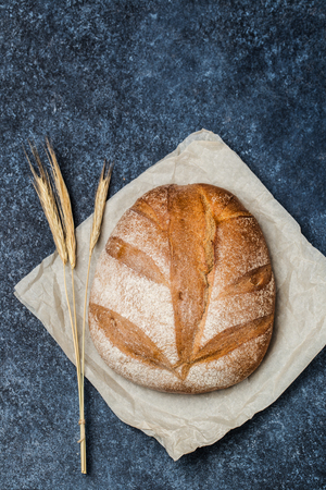 Fresh bread on table. Homemade bread. Kitchen or bakery poster design. Bread background