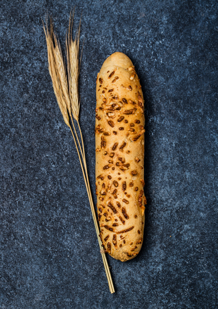 Fresh bread on table. Homemade bread. Kitchen or bakery poster design. Bread background