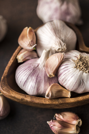 Fresh garlic on a wooden background. Garlic bulbsの写真素材