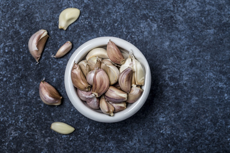 Fresh garlic on a wooden background. Garlic bulbsの写真素材