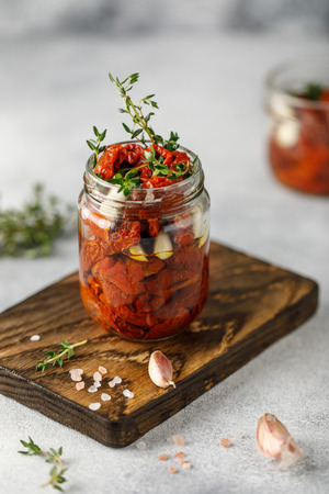 Dried sour cream in the glass jar. Top view. Print for kitchenの写真素材