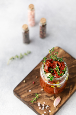 Dried sour cream in the glass jar. Top view. Print for kitchenの写真素材