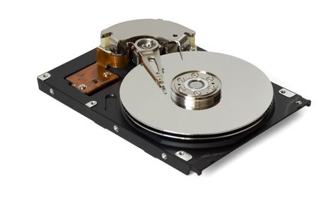 Disassembled hard disc isolated on whiteの写真素材