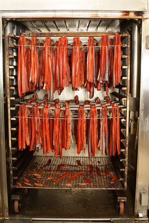 Smoked red salmon in the smoking chamberの写真素材