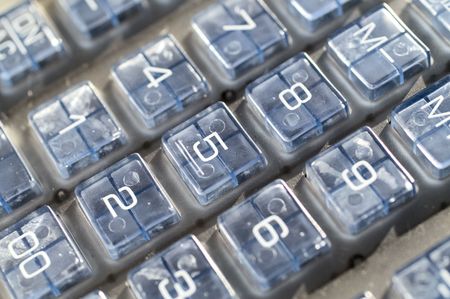 Calculator (office equipment) isolated on whiteの写真素材