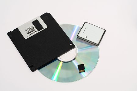 Old floppy disc, CD and modern memory cardsの写真素材