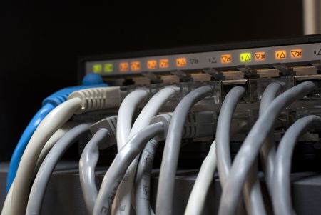 bunch of cables inserted in the network equipmentの写真素材