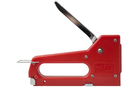 Red stapler close-up isolated on white backgroundの写真素材
