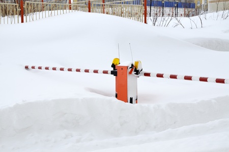 Road gate covered by snowの写真素材