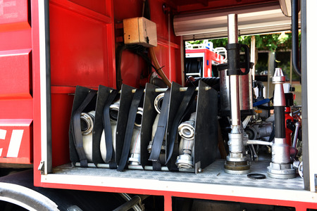 Fire engine with opened equipment compartment