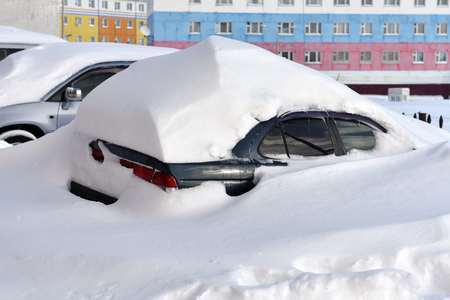 The car buried in snowdrift after the blizzardの写真素材