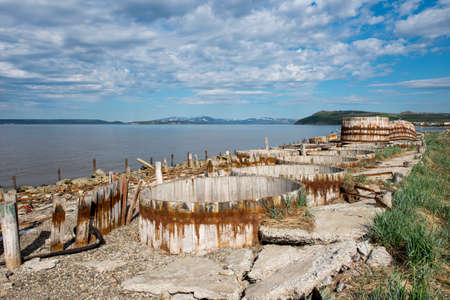 Ruins of old fish processing plant in Chukotka, Russiaの写真素材