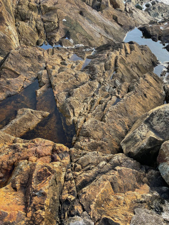 texture of rocks and stones and water in yellow tones