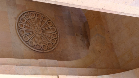 A meticulously detailed circular stone carving that beautifully showcases exceptional architectural craftsmanshipの写真素材