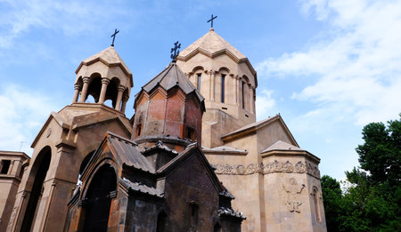 An exquisite Armenian church beautifully showcasing its historical architecture set against a vibrant skyの写真素材