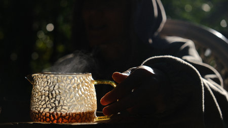 Steam rises gently and gracefully from a beautifully crafted teapot, creating a serene and enjoyable moment for allの写真素材