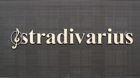 Bucharest, Romania - 17 February 2019: Stradivarius logo on Unirea Shopping Center building. Stradivarius is an international women and men clothing fashion brand from Spain owned by the Inditex groupのeditorial素材