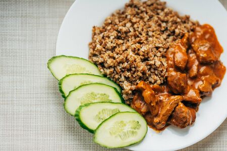 Fried meat with onions and buckwheatの写真素材