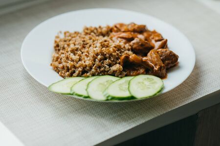 Fried meat with onions and buckwheatの写真素材