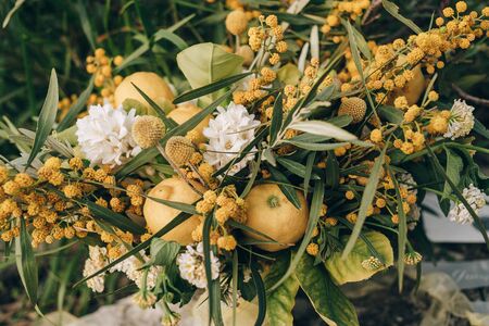 Wedding bouquet of flowers in hands of bridesmaidの写真素材