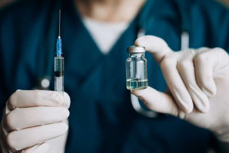 The doctor is collecting the vaccine. Vaccination.の写真素材