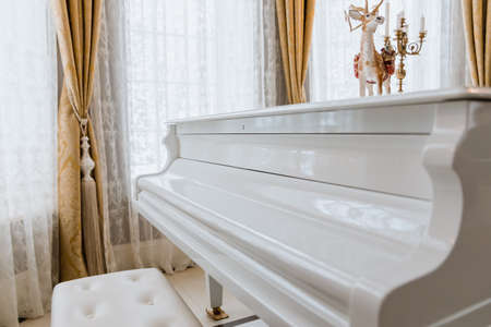 White piano in the room. Piano. Musical instrument.の写真素材