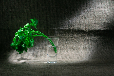 a glass of water and greensの写真素材