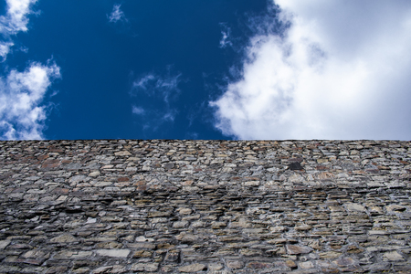 sky and clouds on stone wall backgroundの写真素材