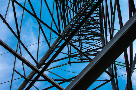 high voltage power lines against the blue skyの写真素材