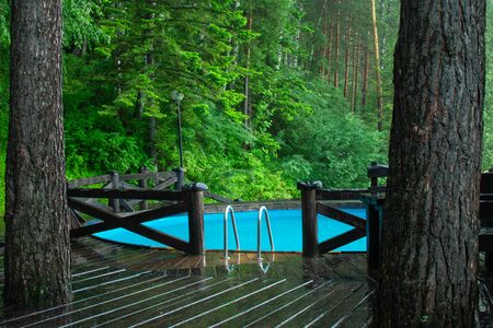 blue pool in green forestの写真素材