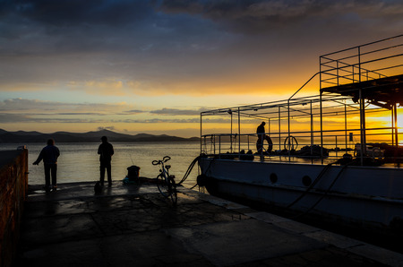 fishermen at sunsetの写真素材