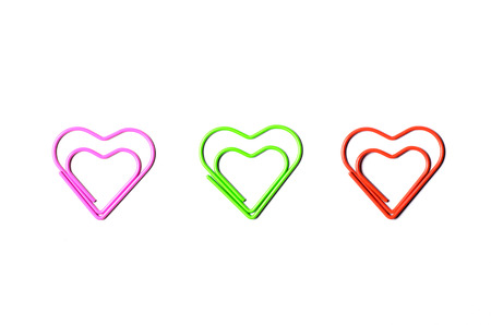 Heart shaped paper clip in 3 colorsの写真素材