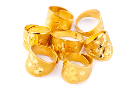 Pure solid gold rings on white background (24k gold ring)の写真素材