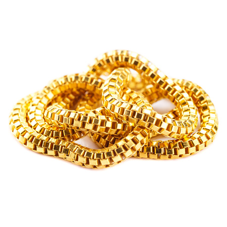 Pure solid gold chain necklace bracelet on white background (24k gold isolated)の写真素材