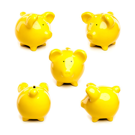 Different views of yellow piggy pig bank on white background (Front Back Side Angle)の写真素材
