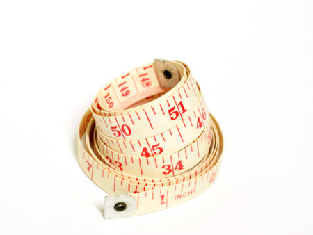 Old measure around the waist on white.