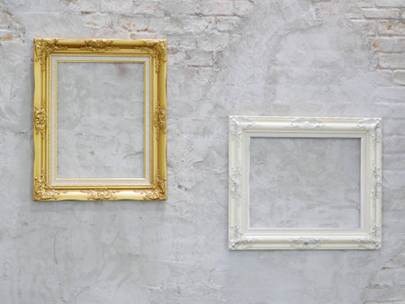 gold and white picture frame on wallの写真素材