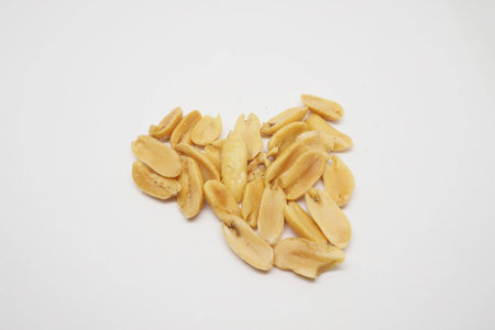 salted peanuts on white background.の写真素材