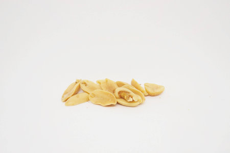 salted peanuts on white background.の写真素材