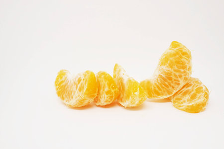 peeled orange on white background.の写真素材
