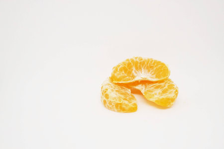 peeled orange on white background.の写真素材